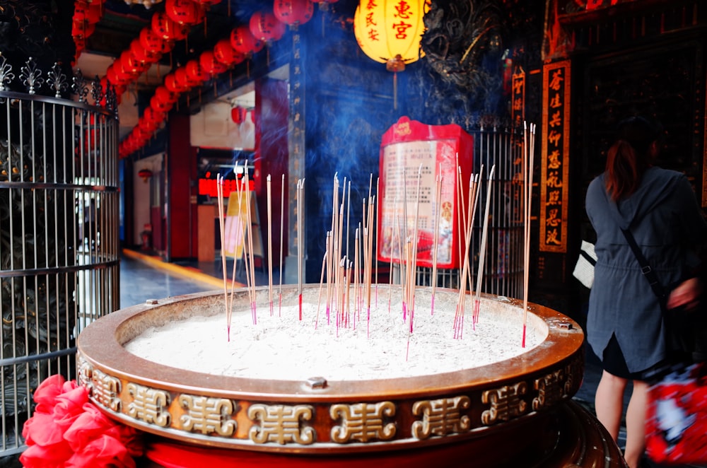 red and white candles on brown wooden round table