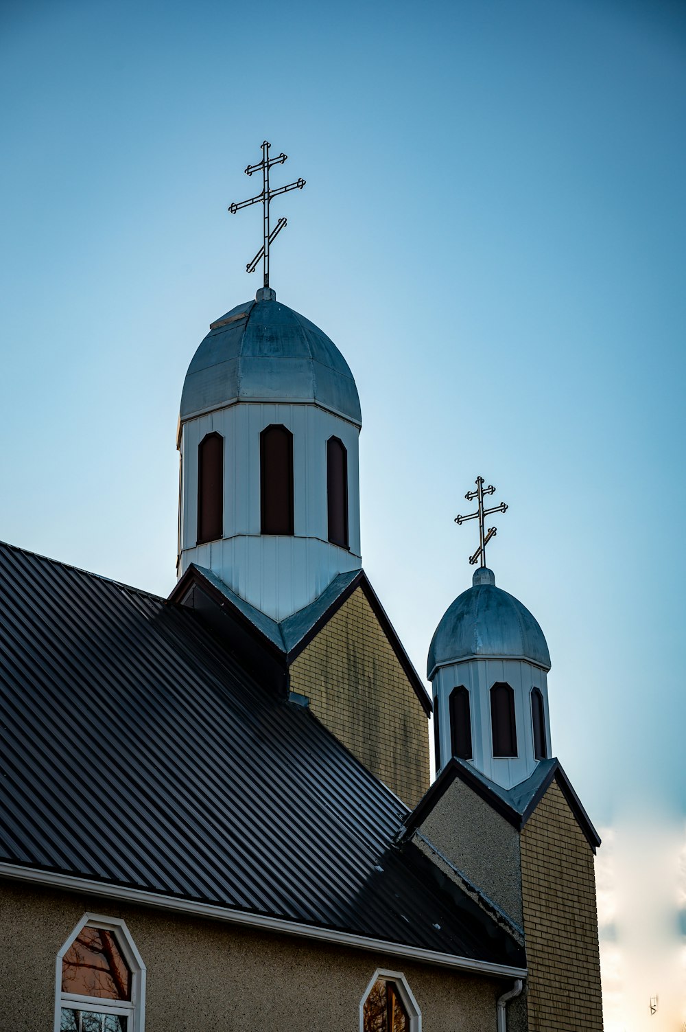 brown and white church under blue sky during daytime