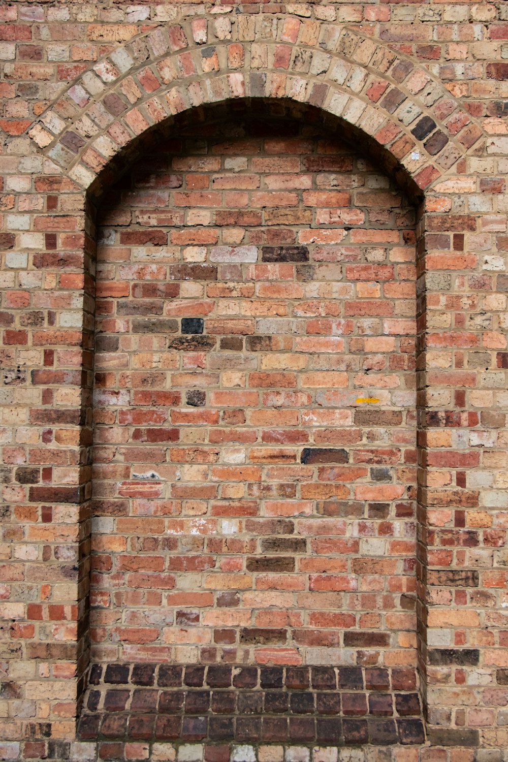 brown brick wall during daytime