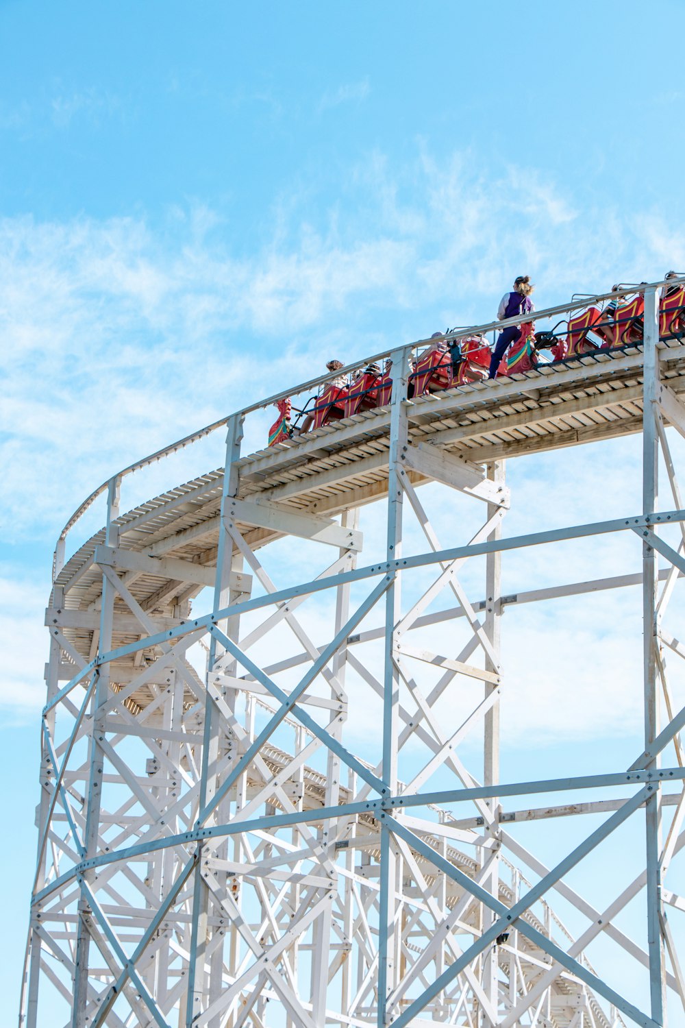 people on white metal tower during daytime