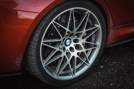 Set of BMW wheel rim protectors installed on a shiny car wheel
