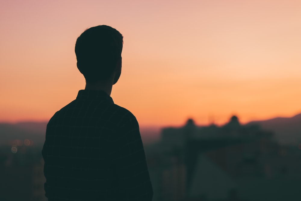 silhouette of man during sunset