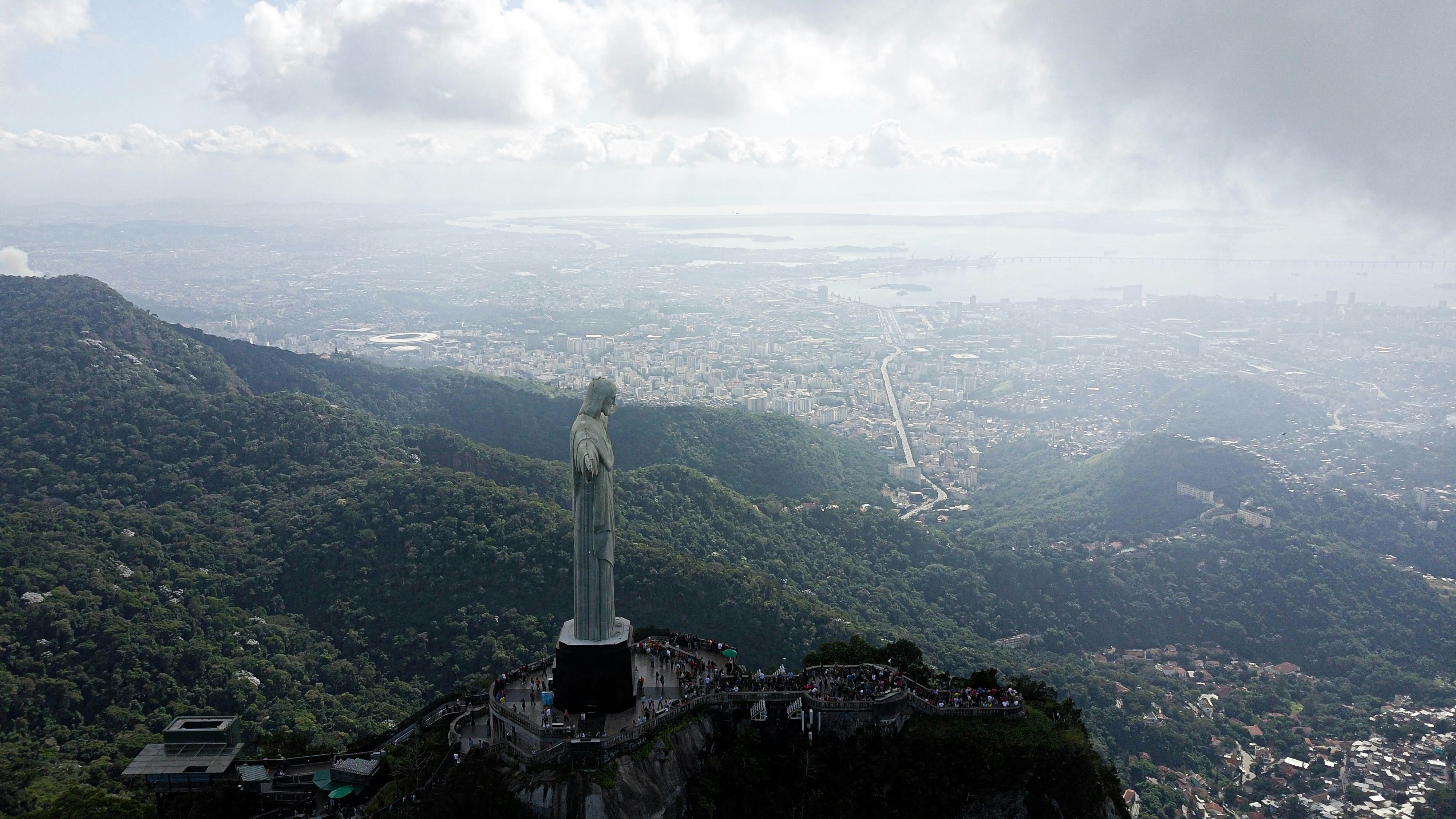 statue of liberty on top of mountain during daytime
