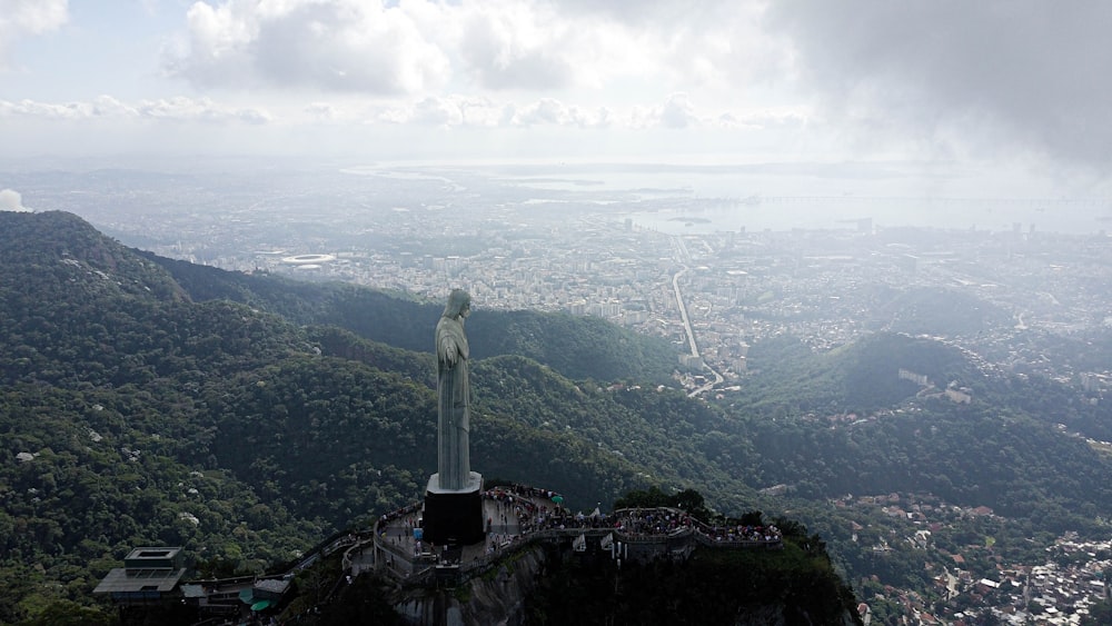 statue of liberty on top of mountain during daytime