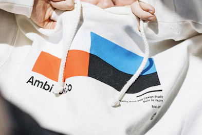 Close-up of a cozy hoodie with a unique design, draped over a chair.
