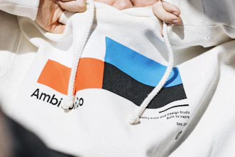 Artist sketching graphic designs for a limited edition pullover.