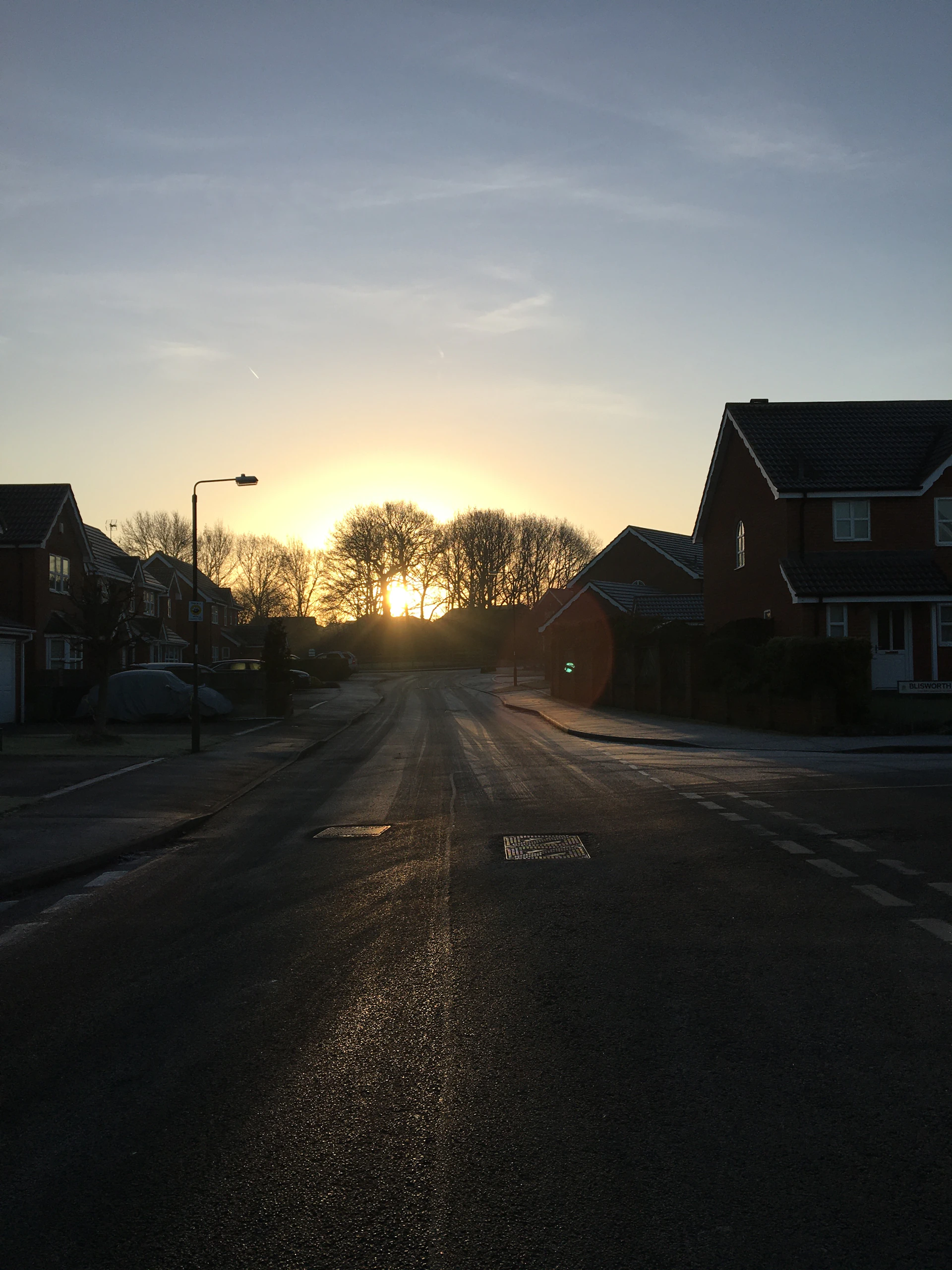 woman wearing yellow long-sleeved dress under white clouds and blue sky during daytime