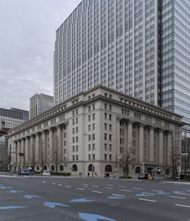 people walking on sidewalk near building during daytime