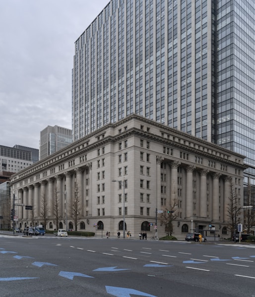 people walking on sidewalk near building during daytime