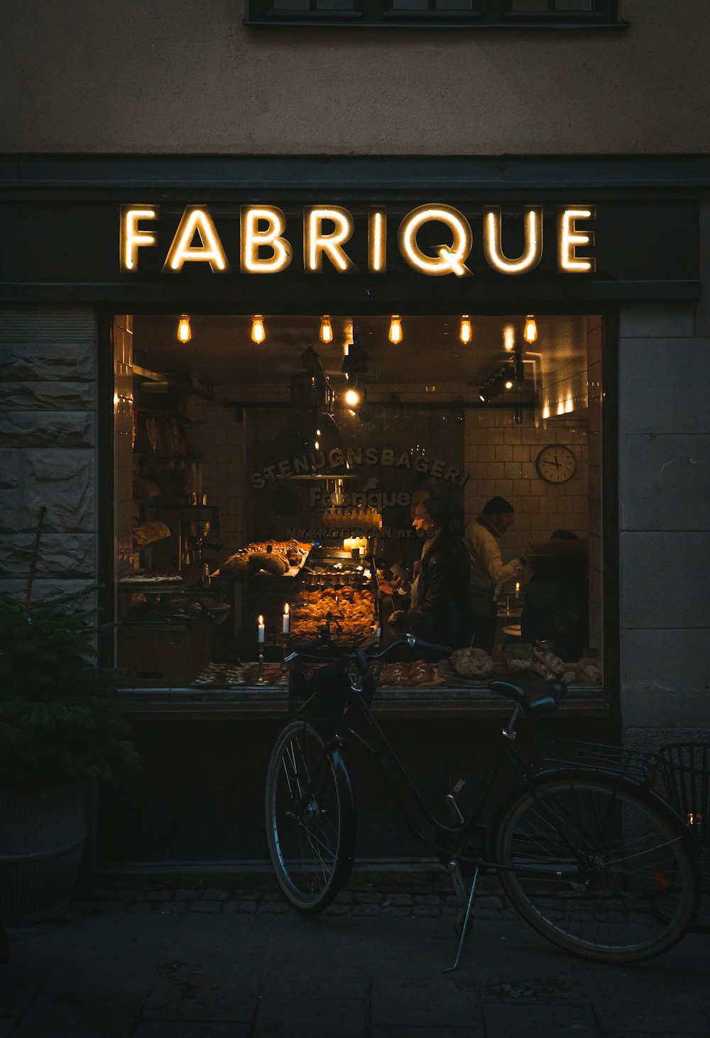 black bicycle parked beside brown wooden table