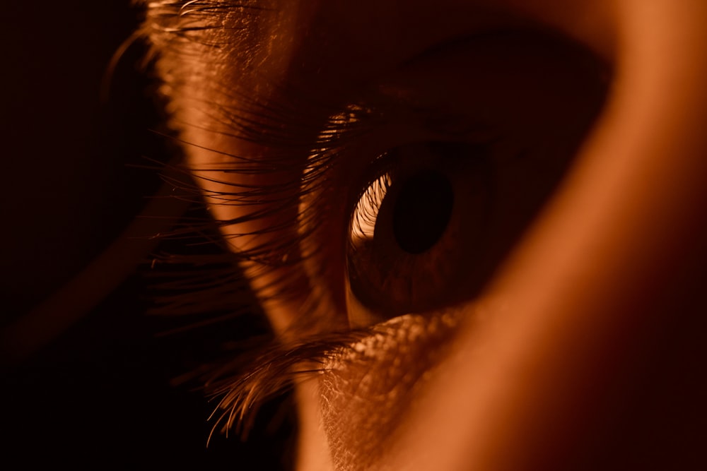 persons eye in close up photography