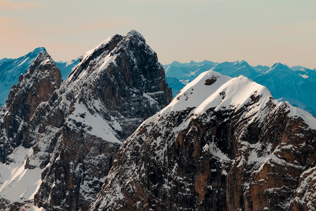 snow covered mountain during daytime