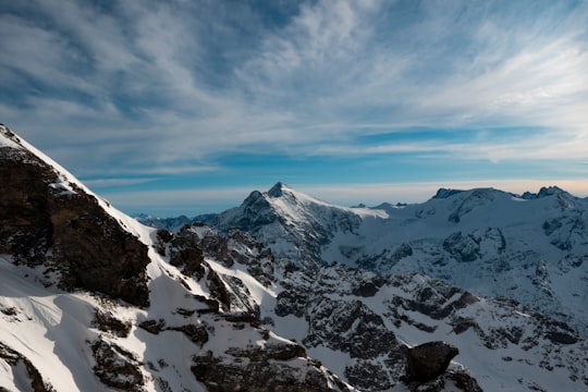 snow covered mountain under blue sky during daytime in Titlis Switzerland