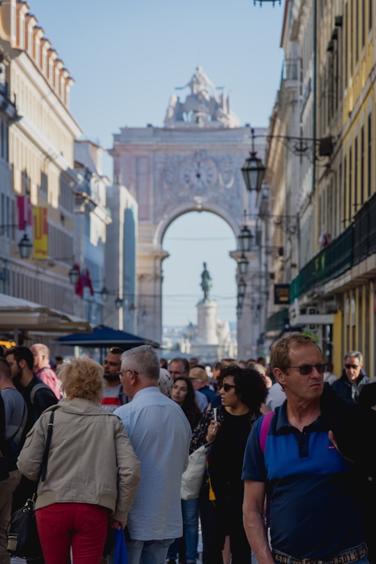 people walking on street during daytime in Praça do Comércio Portugal