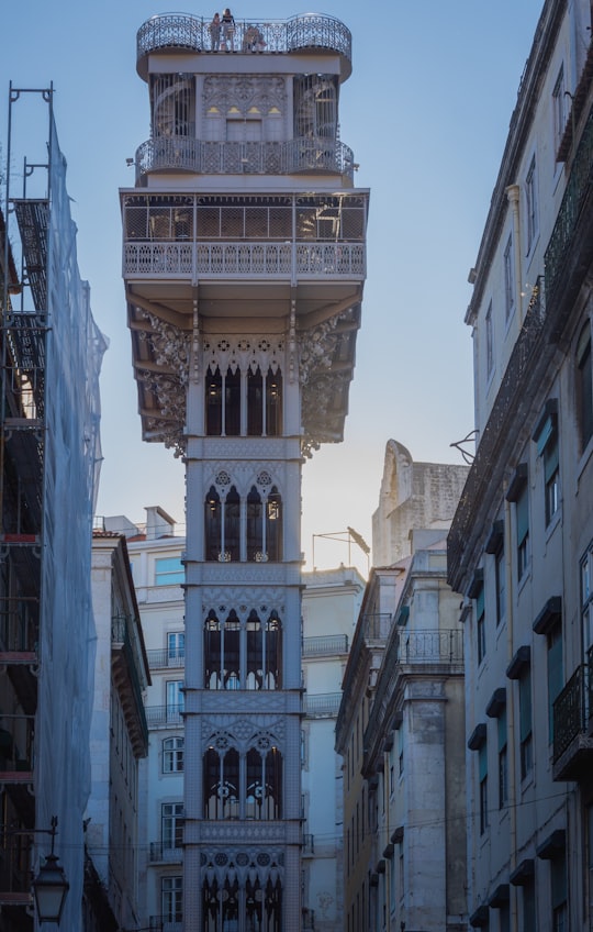 white and brown concrete building in Santa Justa Lift Portugal