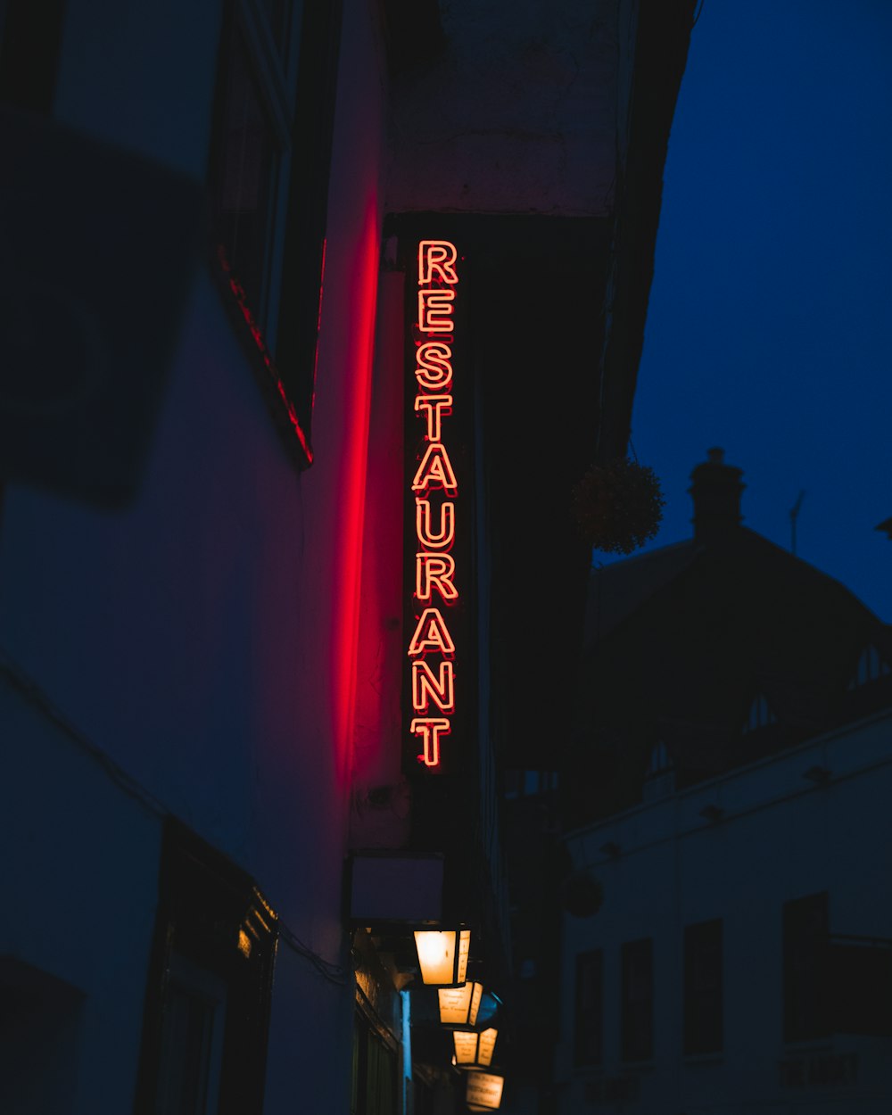 red and white UNKs neon light signage