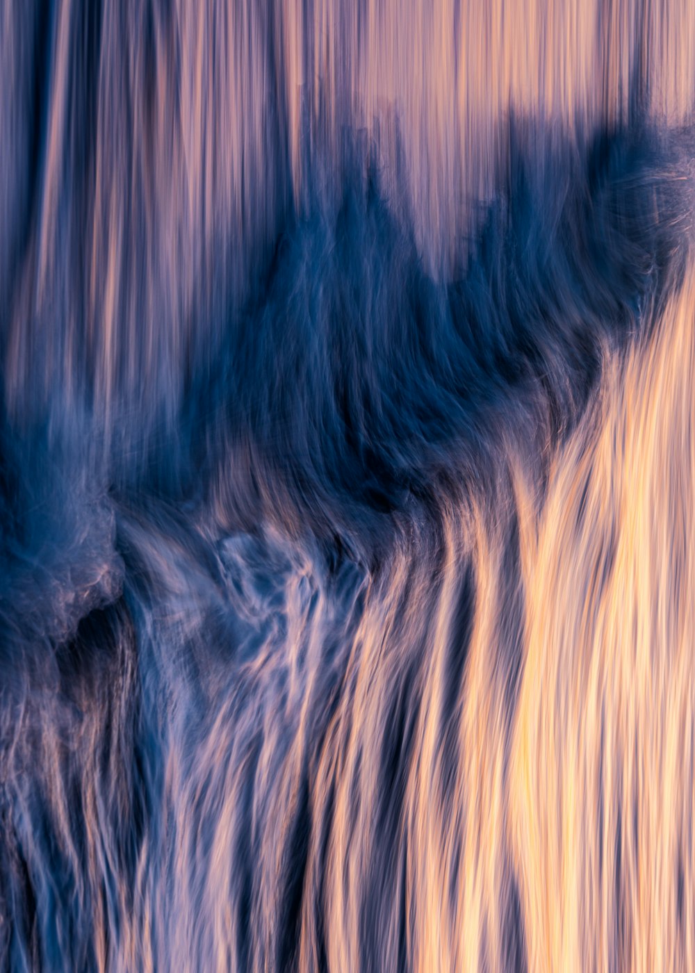 a blurry photo of a waterfall with water