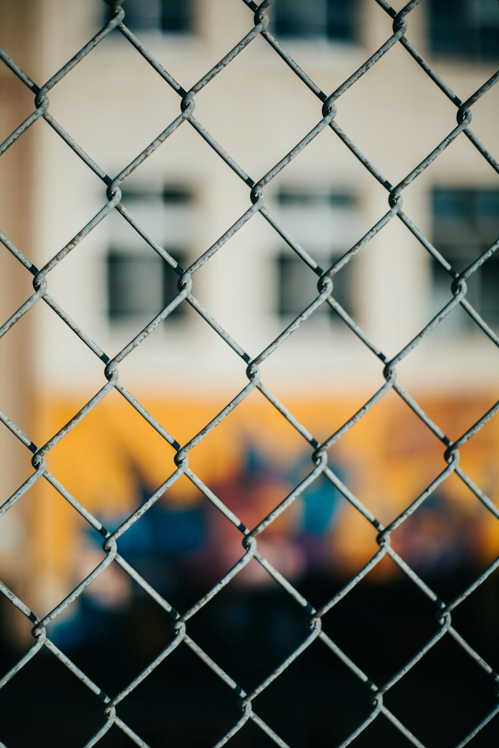 white metal fence with blue metal fence