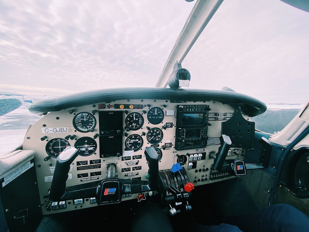 white and black helicopter under white clouds during daytime