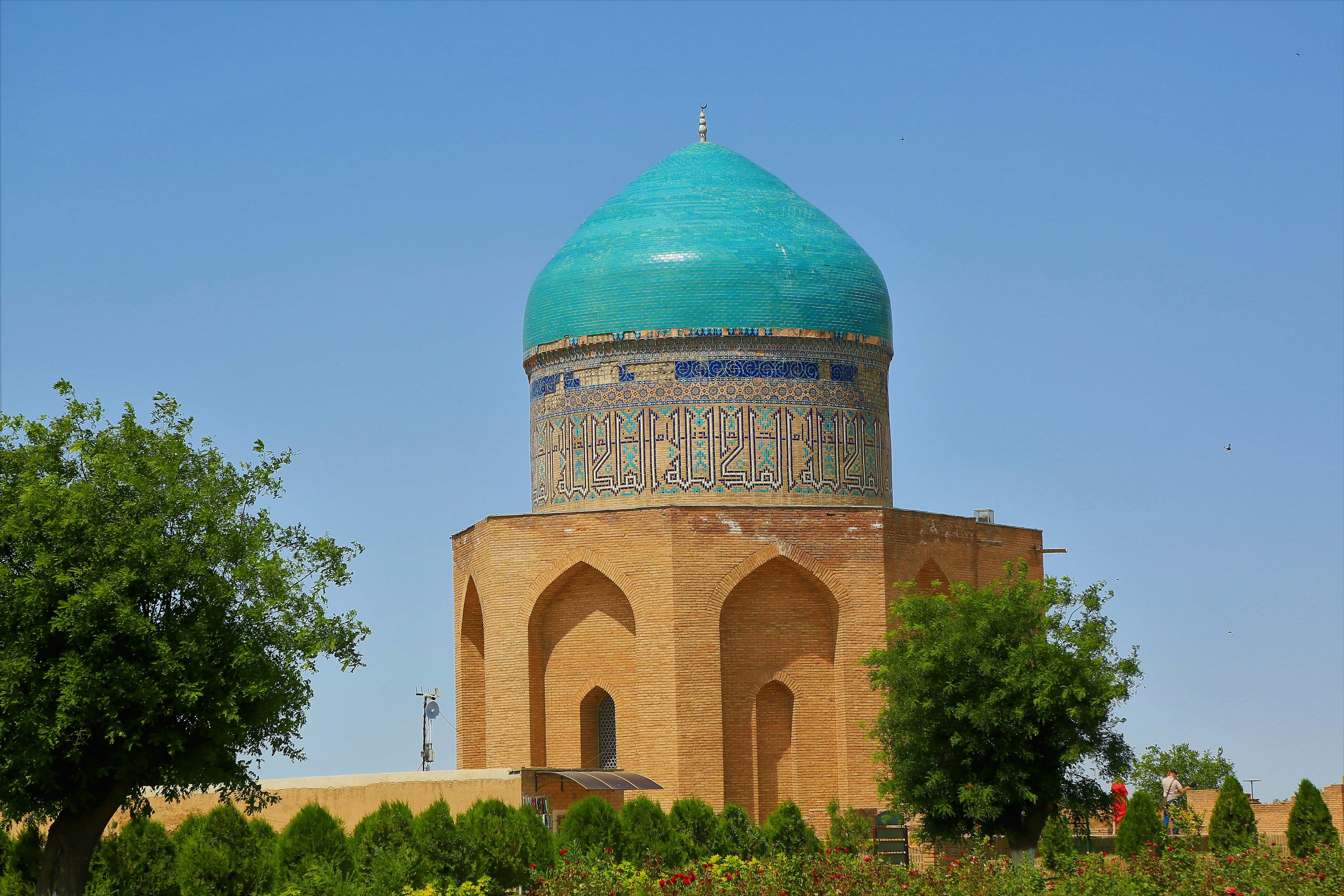 green and brown dome building under blue sky during daytime