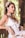 woman in white sleeveless dress wearing white flower crown