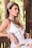woman in white sleeveless dress wearing white flower crown