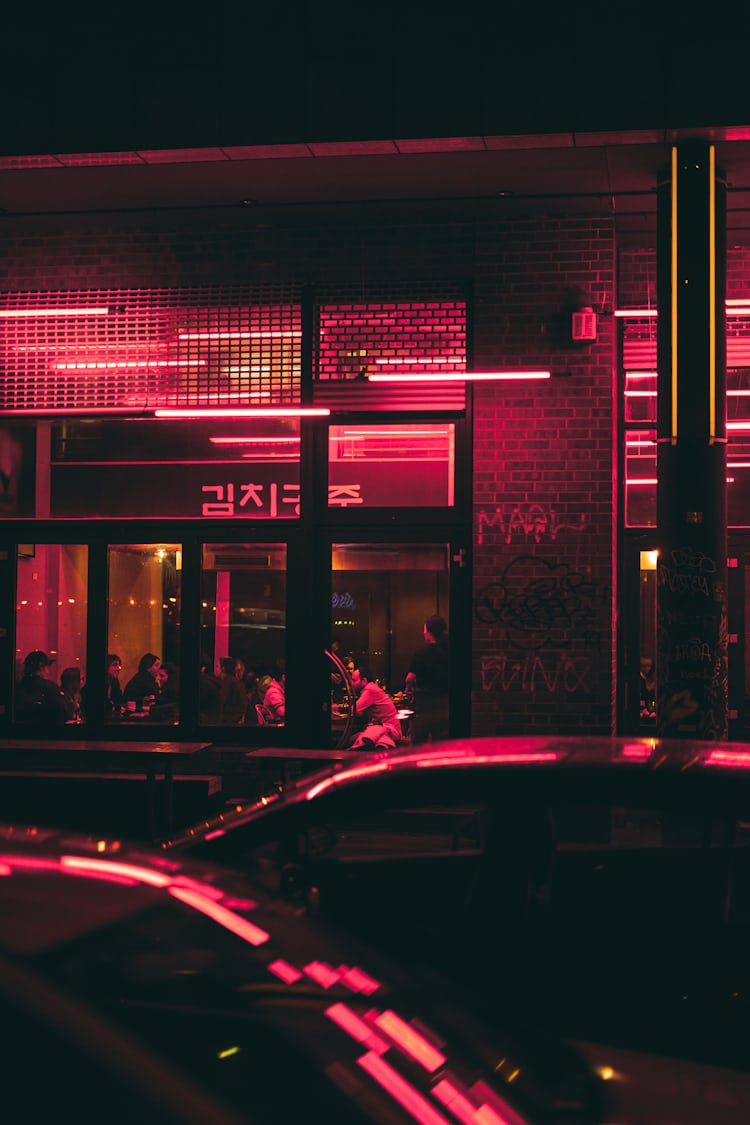 cars parked in front of store during night time photo – Free Image on ...