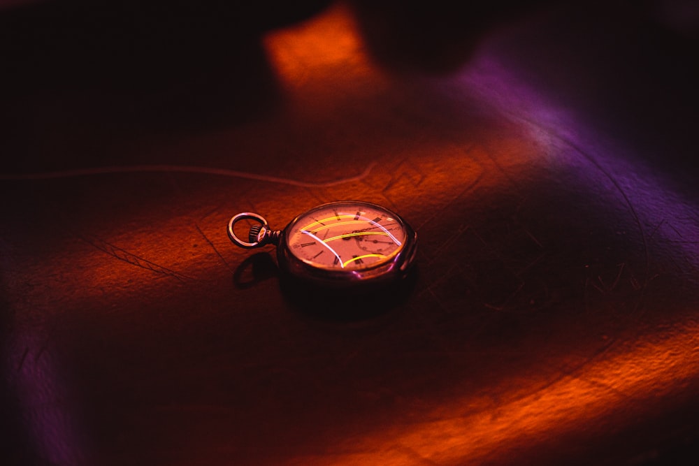 silver and gold pocket watch