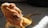 Close-up of a vibrant bearded dragon basking under a heat lamp.