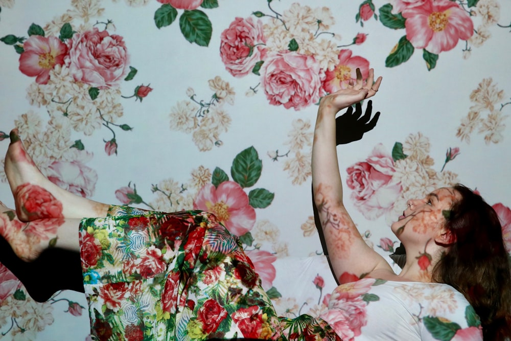 woman in red green and white floral dress