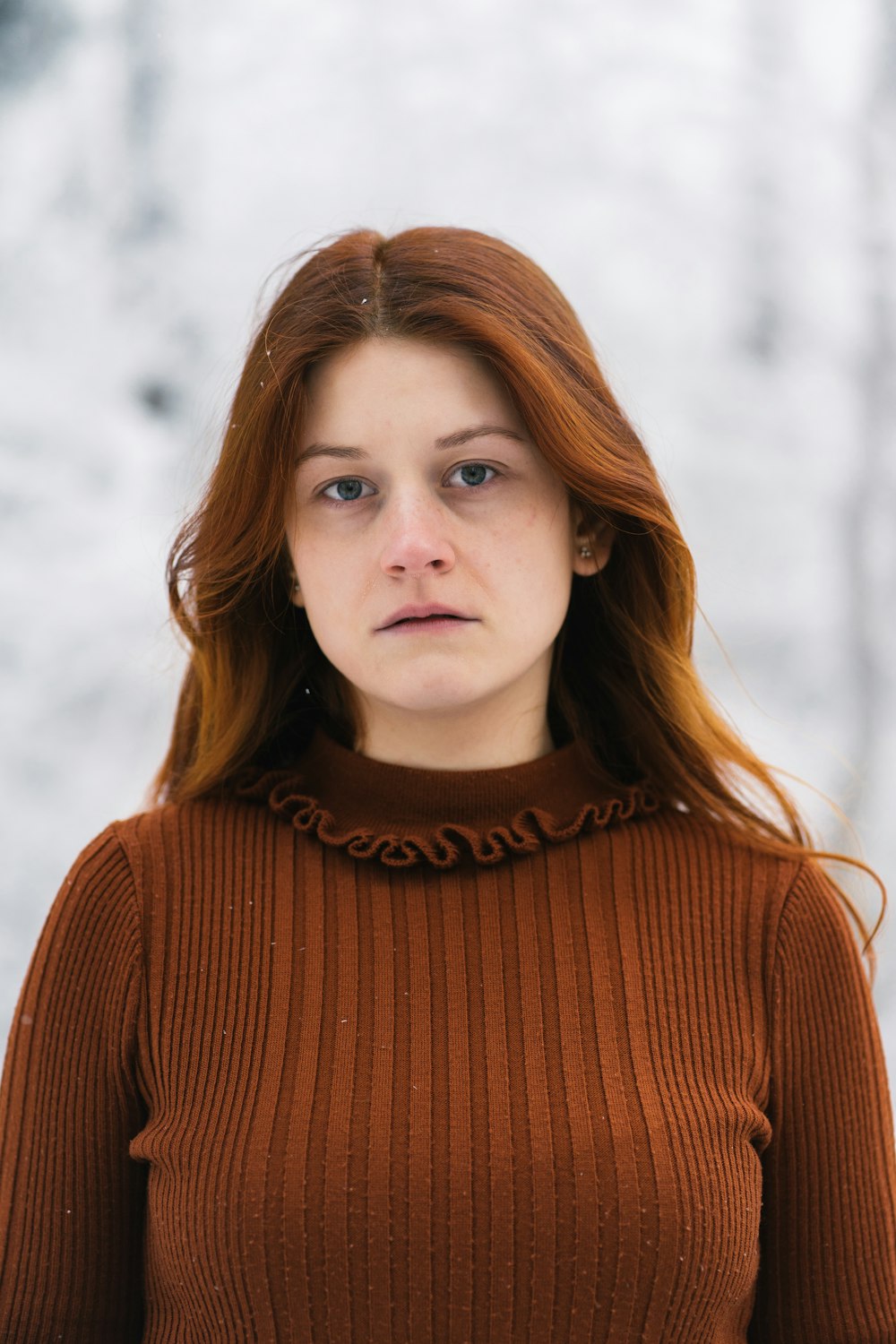 woman in brown turtleneck sweater