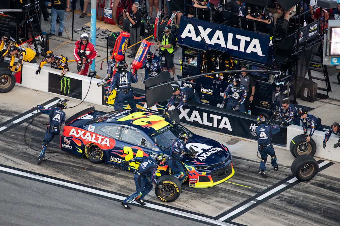 black and yellow racing car, Pitstop during the 2019 Daytona 500
