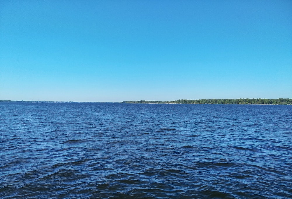 blue sea under blue sky during daytime