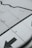 A close-up view of a section of an airplane wing with visible rivets and the words 'NO STEP' printed on it. Large black arrows and lines are also present on the wing surface, indicating the direction or areas to avoid stepping.