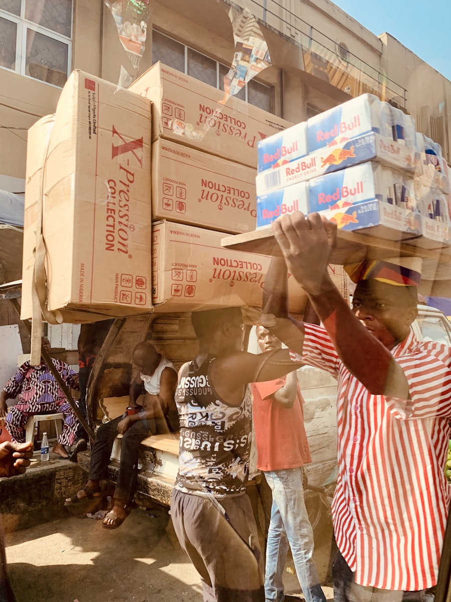 Woman sorting donated items and cardboard boxes