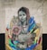 A mural features a woman wearing a headscarf with a serene expression. She holds colorful flowers, and there are vibrant, abstract shapes surrounding her. The text 'Your Brand Your Choice' is written on her clothing. The artwork combines realistic portraiture with abstract elements, creating a striking visual contrast.