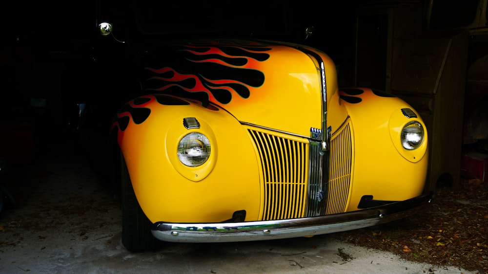 yellow volkswagen beetle in a parking lot