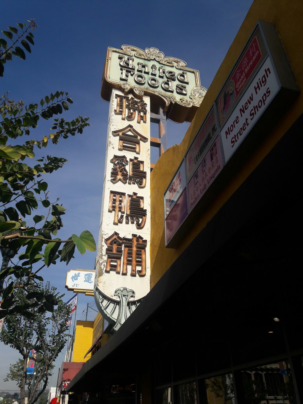 brown and white wooden signage