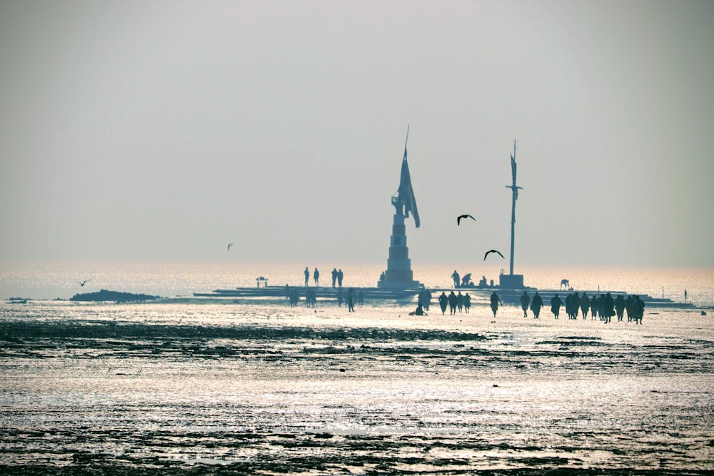 people walking on beach during daytime