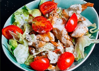 vegetable salad on blue ceramic bowl