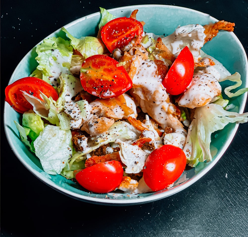 vegetable salad on blue ceramic bowl