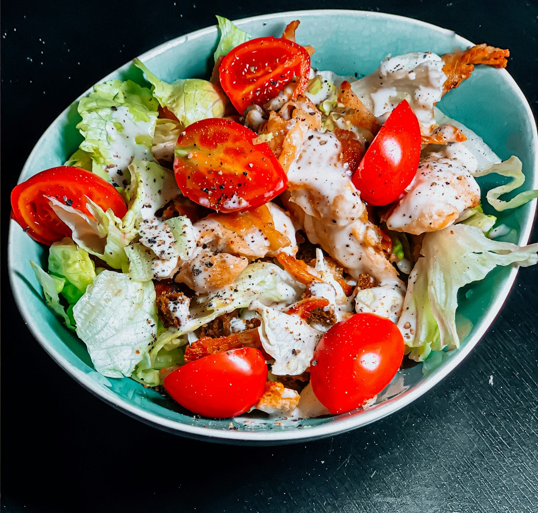 Close-up of grilled chicken breast with roasted vegetables on a plate, high-protein macro-balanced meal