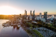 city buildings near body of water during daytime