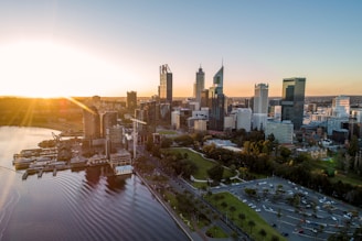 city buildings near body of water during daytime
