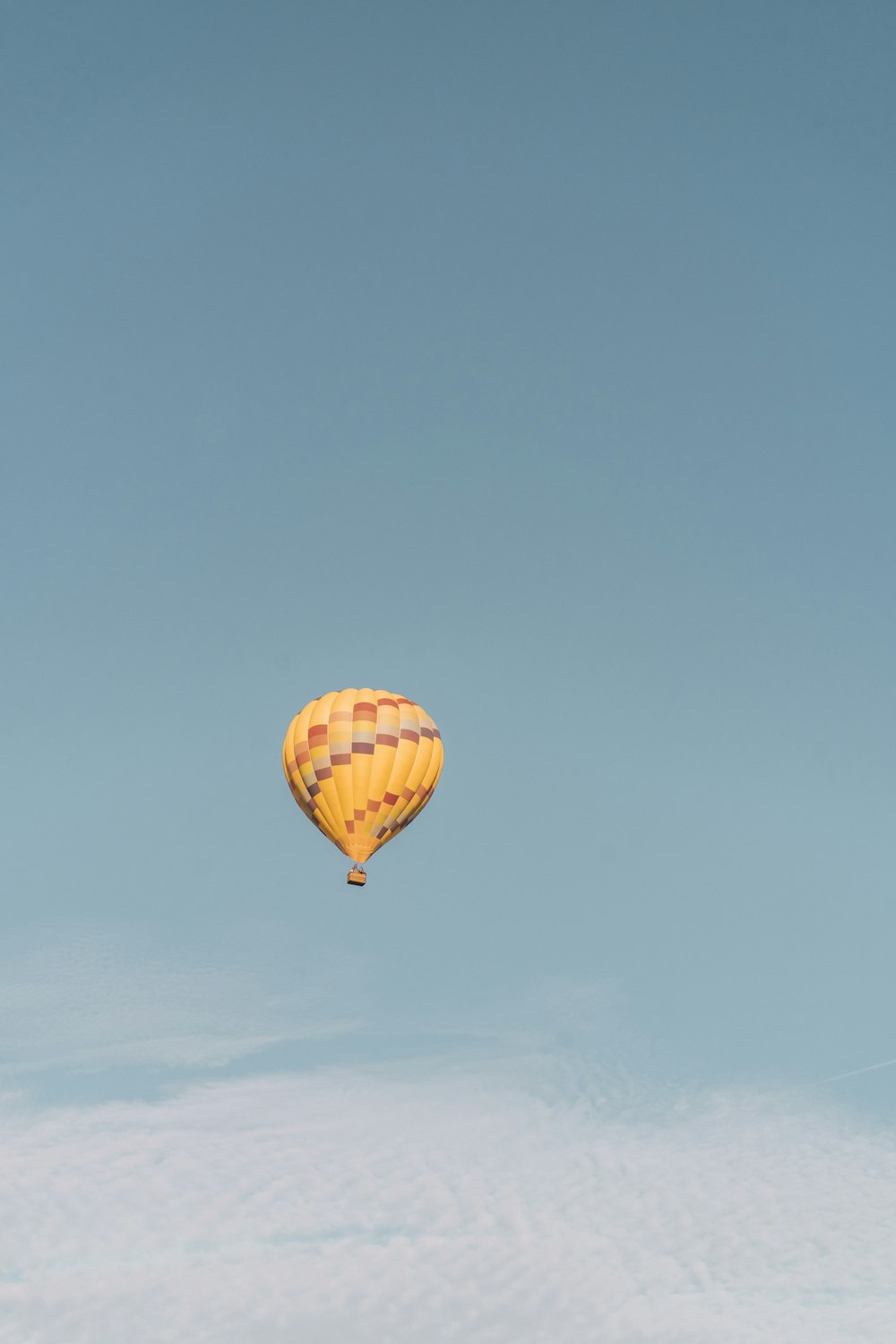 yellow hot air balloon in the sky