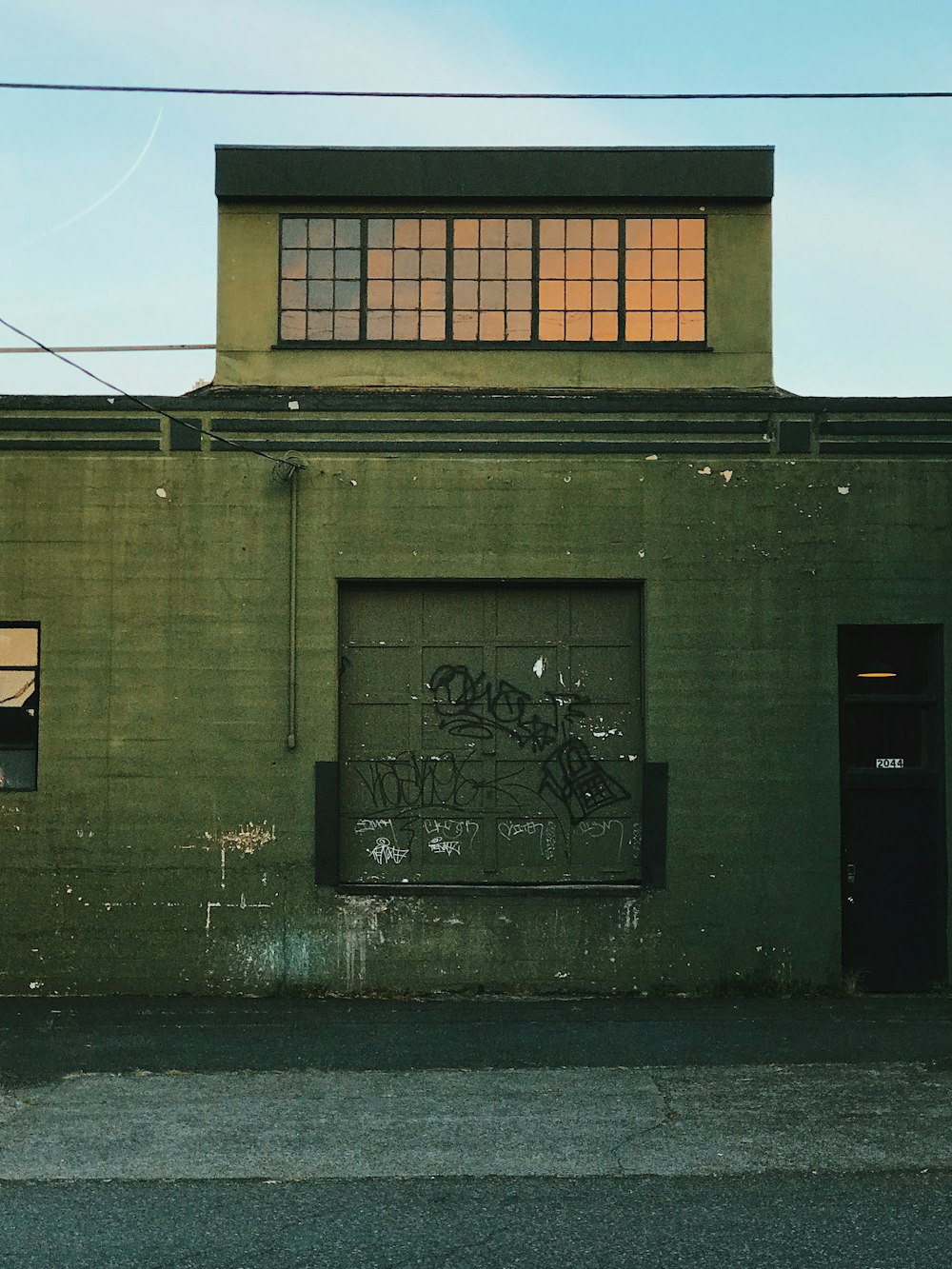 black and white graffiti on gray concrete building during daytime