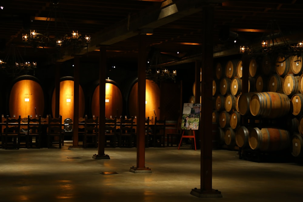 brown wooden barrels on brown wooden floor