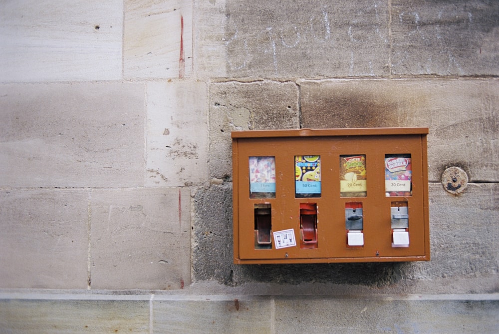 red and blue wall mounted telephone booth