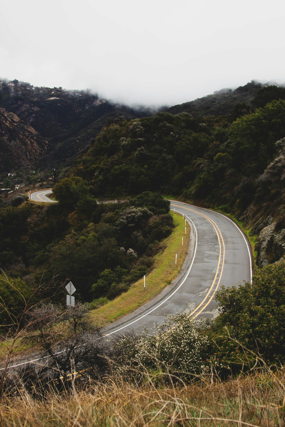 a winding road in the middle of a mountain