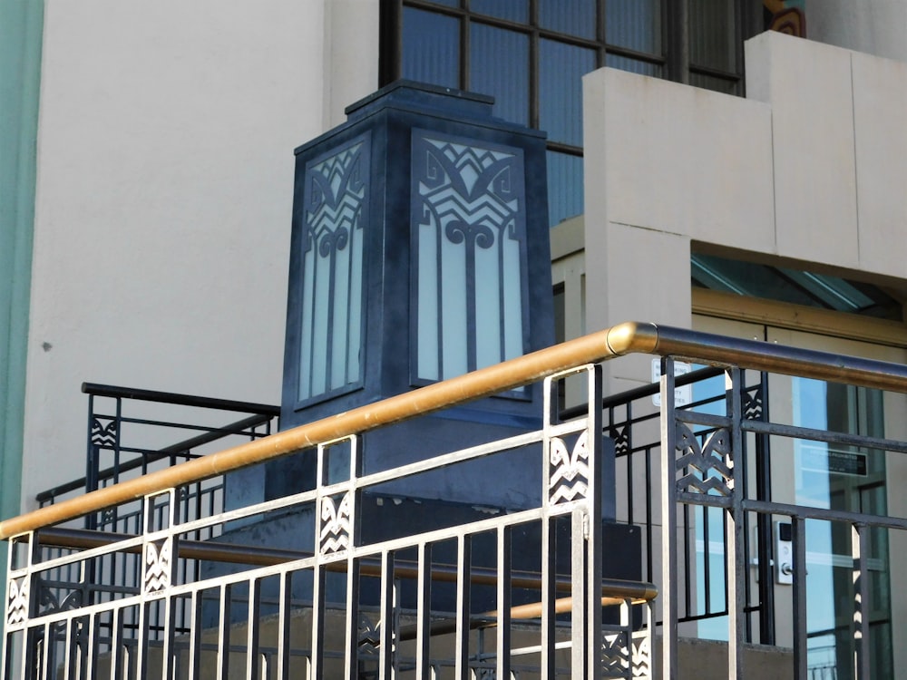 black metal railings near gray concrete building